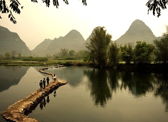 Walking on the river, Yangshuo, China