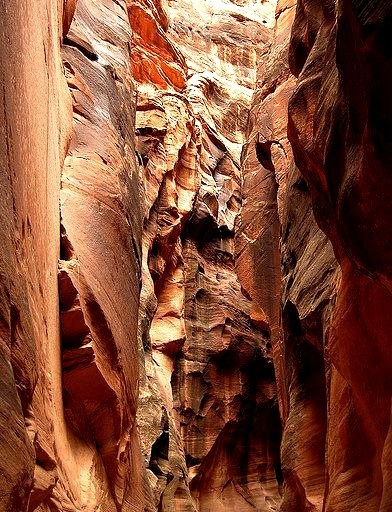 Hiking into Buckskin Gulch, reputed to be the deepest, darkest and narrowest slot canyon in North America in Utah, USA